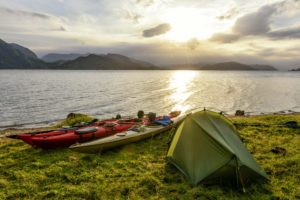 Camping and Kayaking in a Fjord in Norway during summer
