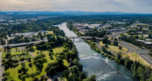 An aerial view of Eugene, Oregon with the Willamette River winding it's way through the city.
